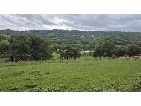 saint come d'olt  terrain plat de 668 m²  à 2 pas du coeur de village