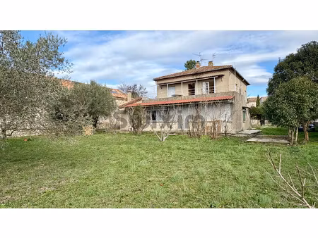 maison divisée en 2 appartements indépendants+ terrain const