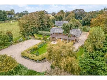 propriété1 40 ha (prairie 1 20ha) 2 bâtisses  3 logements pour 293m2 habitables