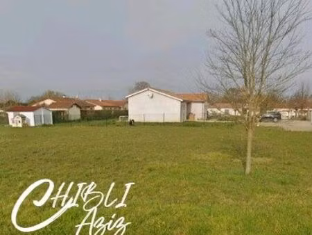 terrain constructible de 1 242 m² situé dans un quartier calme et tranquille  idéal pour c