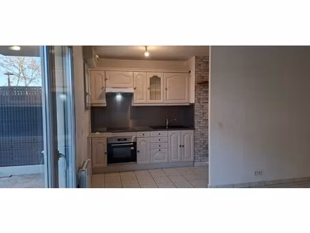 appartement 3 pièces de 61 m² en rez-de-chuassée avec terrasse  jardin et parking