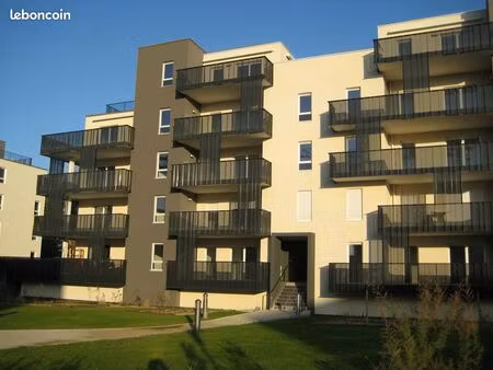 t2 vue sur jardin et bâtiment basse consommation
