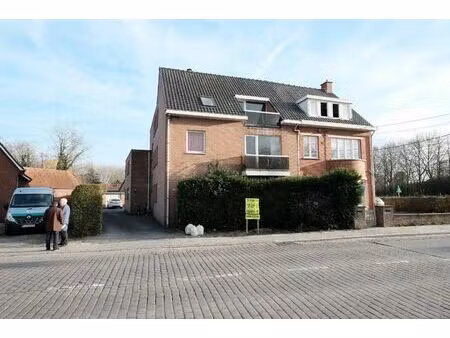 opbrengsteigendom bestaande uit 5 appartementen en 6 garages