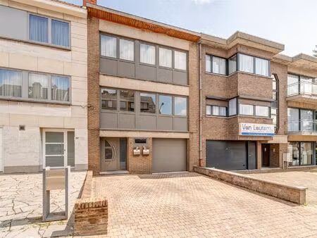 opbrengsteigendom met twee appartementen  tuin en garage in wemmel