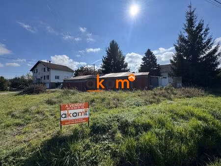 terrain à bâtir avec bâtiment à usage de dépôt et d'atelie