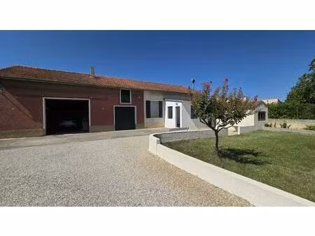maison de 72 m² avec une véranda sur un terrain de 1306 m² et 140 m² de dépendances