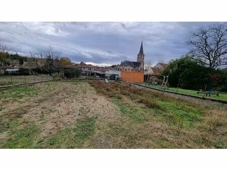 terrain à batir 567 m² dans le bourg de mariol proche de l' école