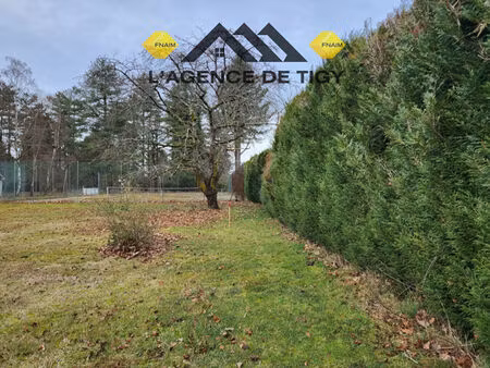 terrain a batir dans un parc boise exeptionnel