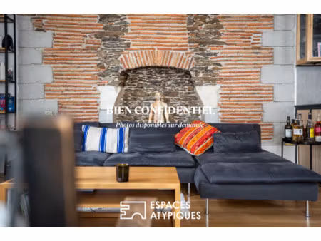 appartement d'exception de 104 18 m² : alliance de la pierre  de la brique et du design co