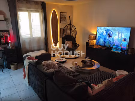 appartement type 3 en rez-de-chaussée - 63 m² - balcon et stationnements dans résidence sé