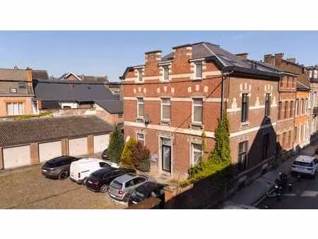 immeuble de rapport+12 garages+terrain a batir 12 logements