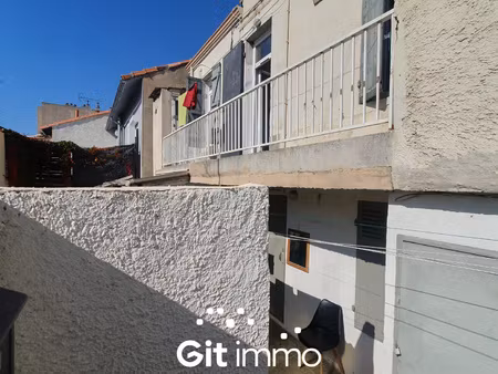 petit immeuble avec 2 appartements loués