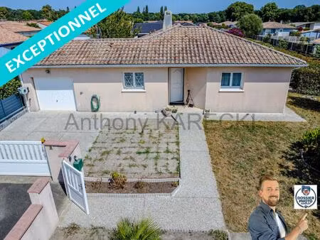 grande pièce de vie + 3 chambres + grand garage + parkings