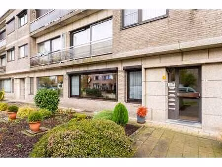 gelijkvloers 2 slpk. appartement met tuin en garage