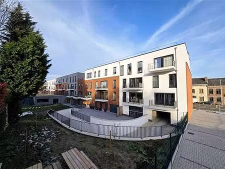 appartement 1 ch de +/-60m² avec terrasse  pkg int + cave !