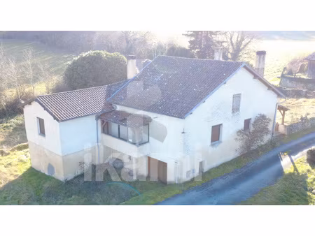 maison 150 m2 avec volumes et potentiel au coeur d'un environ