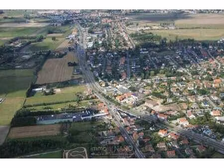 un terrain à bâtir situé au calme de 1.097 m² dans un emp...