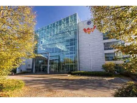 modern office building around an atrium with services