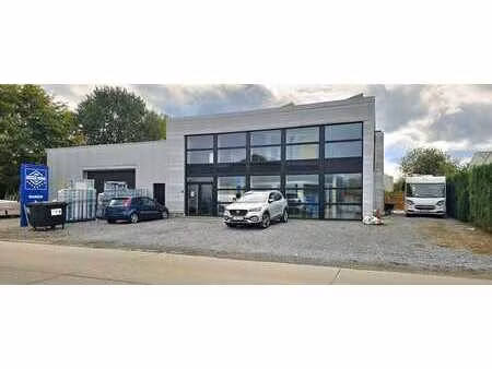 strategisch goed gelegen bedrijfsgebouw met woonst in her...