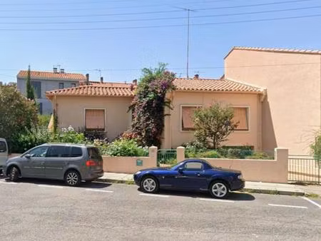 maison 3 faces de plain pied avec jardin et garage