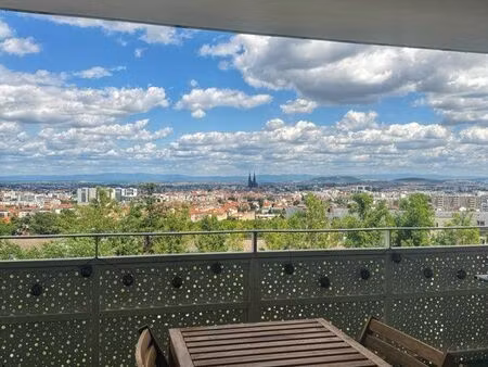 magnifique f2 neuf+ garage vue cathédrale