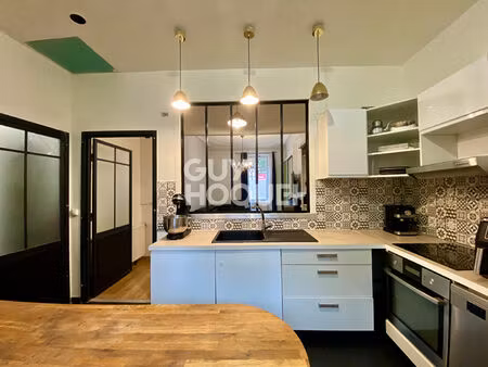 appartement t4 traversant en rez-de-chaussée avec grande terrasse dans le centre-ville de 