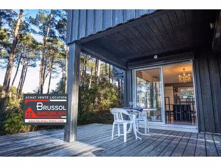 lacanau golf maison d'architecte vente 3 chambres grand terrain chalet bois agence brussol