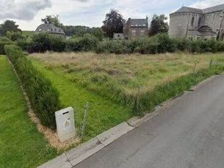 terrain à bâtir en plein centre du village de glons