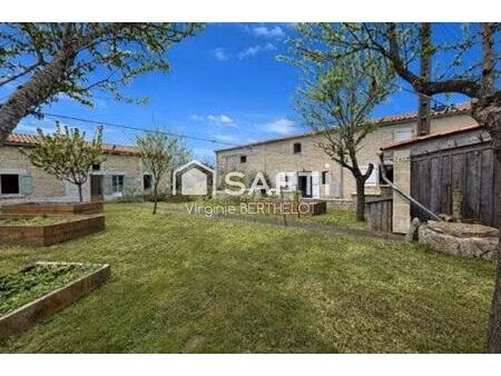 bel ensemble immobilier compose de 2 maisons en pierre a aiffres !