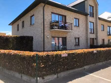 instapklaar ruim gelijkvloers appartement met tuin  garag...