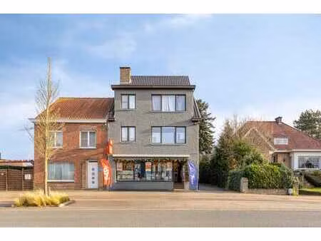 opbrengsteigendom met 5 app  4 garages & handelszaak