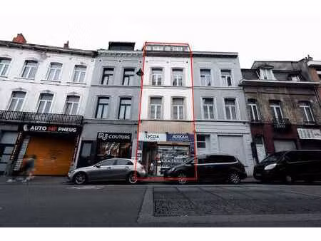 immeuble mixte avec commerce et jardin