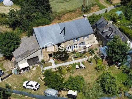 propriété composée de deux maisons habitables  un garage  un atelier  édifiée sur un terra