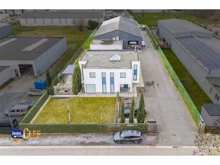 uniek combinatiepand met conciergewoning en bedrijfshal in kmo-zone sint-truiden