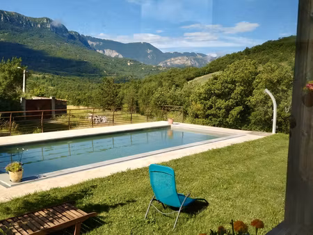 maison ossature bois avec piscine et étang