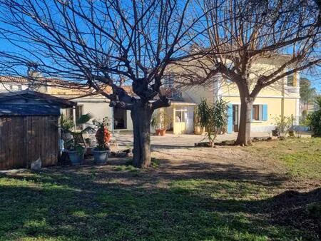 vente de 2 appartements en rdc: un t3 avec terrasse et un studio avec véranda sis à lunel-