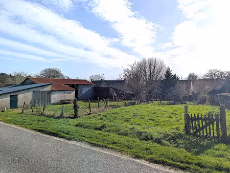 terrain avec dépendance  de 1 103 m2 constructible