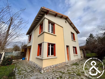 maison avec jardin  garage et possibilités multiples