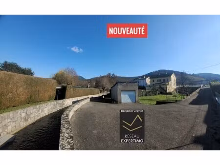 terrain constructible  plat et ensoleillé avec maison existante à gunsbach