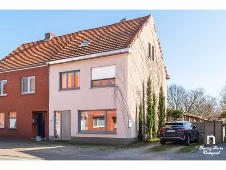 ruime halfopen woning met tuin en veel potentieel