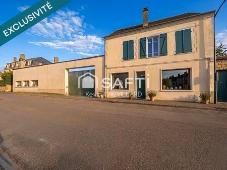 ensemble immobilier composé de 4 appartements et 300 m² de murs commerciaux libres + jardi