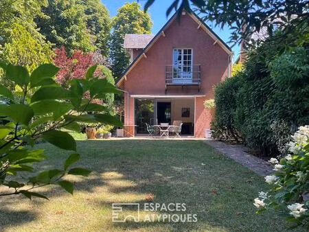 maison meulière rénovée avec jardin et extensions dans un quartier recherché de soisy-sur-