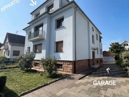 dans maison tri famille appartement avec un grand garage 16 m2 et un jardin proximité des 