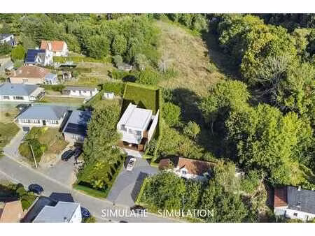 terrain à bâtir de 10 are pour 4-façades