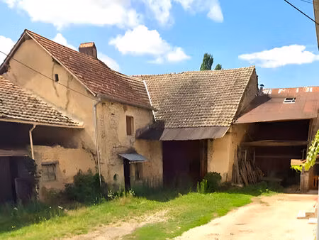 terrain à bâtir + ancien corps de ferme
