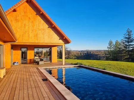 maison contemporaine à ossature bois de 6 ch  200 m² avec piscine  sauna et suite spa  pér