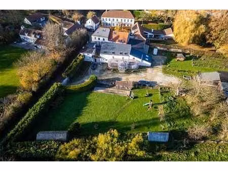 ferme sur +/- 4 hectares avec étangs