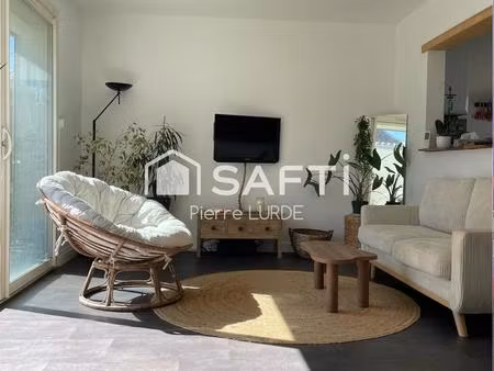 maison mitoyenne de 68 m2 avec garage et jardin