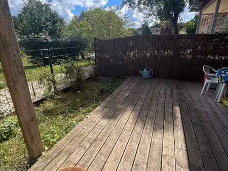 appartement t3 de 65 m² en rez-de-chaussée avec terrasse et parking