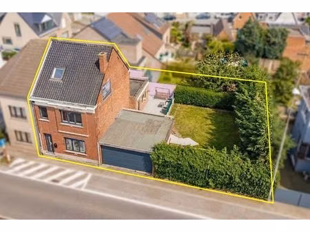 instapklare woning met 4 slks  garage en aanpalende bouwgrond
